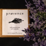 Soap bar with 'provence' branding and lavender flowers on a dark background